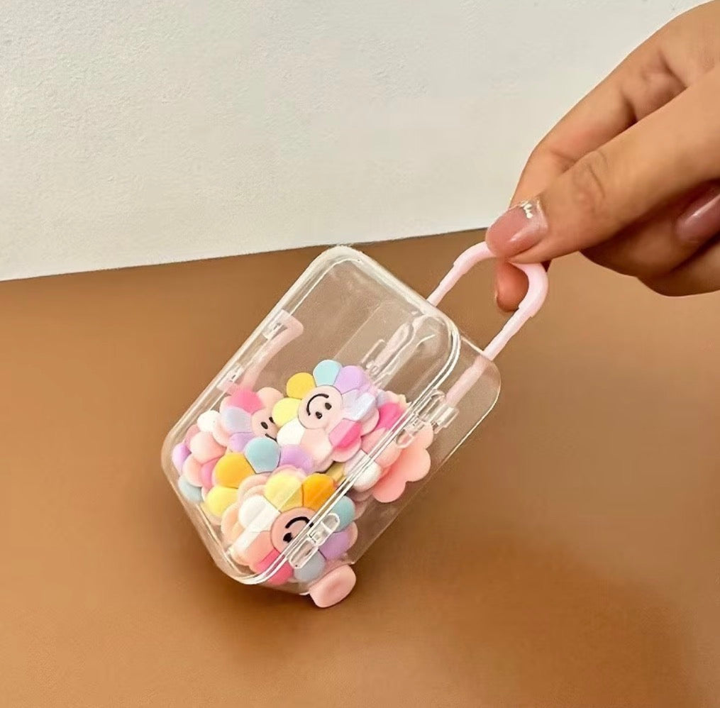 1 transparent pink suite case